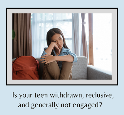 A woman sits on a couch while looking out the window with a blank look and the text “is your teen withdrawn, reclusive, and generally not engaged?”. Learn how a therapist for teens in Roseville, CA can offer support with anxiety and other mental heal