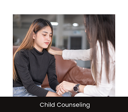 A woman offers support by placing a hand on a teens shoulder. Learn the many ways therapy for children in Roseville, CA can support your child by searching "counseling near me" today.