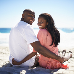 A couple embrace one another while sitting on the beach. This could represent the intimacy cultivated by sex therapy in Roseville, CA. Learn more about the support counseling in Roseville, CA can offer by contacting a therapist in Fair Oaks, CA today