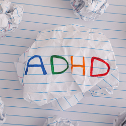 The words ADHD on a piece of paper | If you need help for a child with ADHD see a child therapist in Roseville, CA | Parent help for a child's ADHD behavior in Fair Oaks, CA