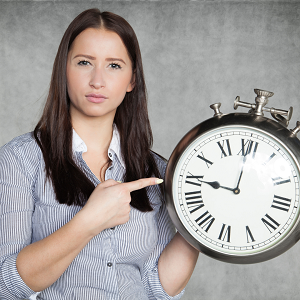Woman holding a clock showing 9pm which could be a boundary | How to set boundaries, learn with a therapist in Roseville, CA | counseling for codependency in Fair Oaks, CA