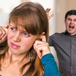 A woman plugs her ears with her fingers as her partner yells. A marriage counselor in California can offer support with marriage counseling in Sacramento. Learn more by searching "marriage counseling near me" to learn more! 95678