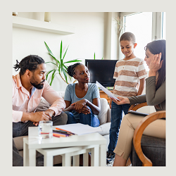 A child talks to their parents and a therapist while smiling. This represents the support therapy for children in Roseville, CA can offer. Learn more about teen therapy in California by contacting a therapist for teens in Roseville, CA.