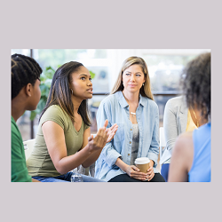 A group of people sit in a circle while discussing something. This represents the support teen therapy in Roseville, CA can offer. Learn more about teen therapy Sacramento by contacting a therapist for teens in Roseville, CA.