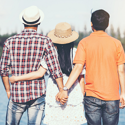 An image of a person holding the hand of another behind the back of their partner. A couples therapist in California can offer support in overcoming relationship issues. Contact a therapist in Fair Oaks, CA to learn about couples retreat in Californi