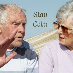 An elderly couple talk with one another with the text "stay calm" between them. A marriage counselor in California can support you with a couples retreat in California. Learn more about the benefits of marriage counseling today. 95678