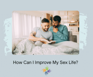 How Can I Improve My Sex Life? Image of two men sitting in bed looking at a book together. For couples counseling and intimacy therapy contact The Relationship Therapy Center in Roseville and Fair Oak