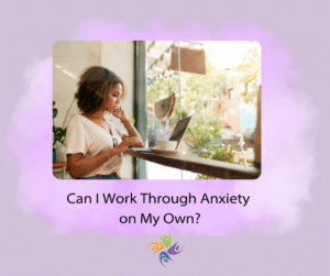  Can I Work Through Anxiety on My Own? Image of a woman looking anxious while sitting at a window in a coffee shop and working at her laptop. .   For anxiety treatment and individual counseling contact The Relationship Therapy Center in Roseville and Fair Oaks California.