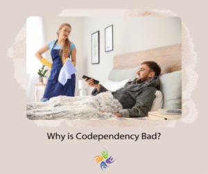 Why is Codependency Bad? Image of a woman cleaning the house, standing and looking down at a man who is sitting on the floor with a remote and watching television. For codependency therapy, both in-person and online, contact The Relationship Therapy Center in Sacramento, Roseville and Fair Oaks California.
