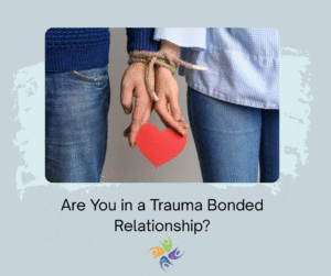 Are You in a Trauma Bonded Relationship? - Image of man and woman bound together with heart dangling from rope. For trauma and relationship therapy, both in-person and online, contact The Relationship Therapy Center in Sacramento, Roseville and Fair Oaks California.